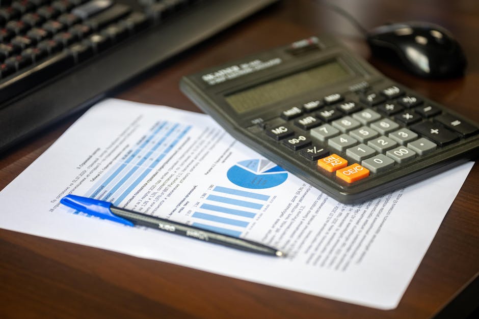 Calculator and financial documents on a desk