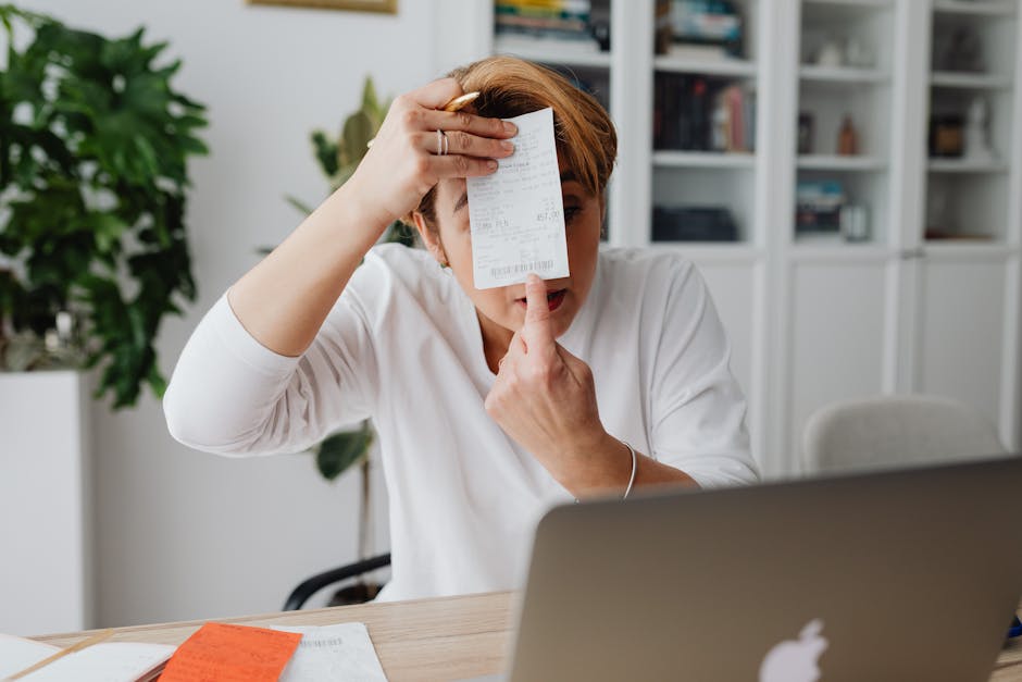 Graduate reviewing bills and loan statements