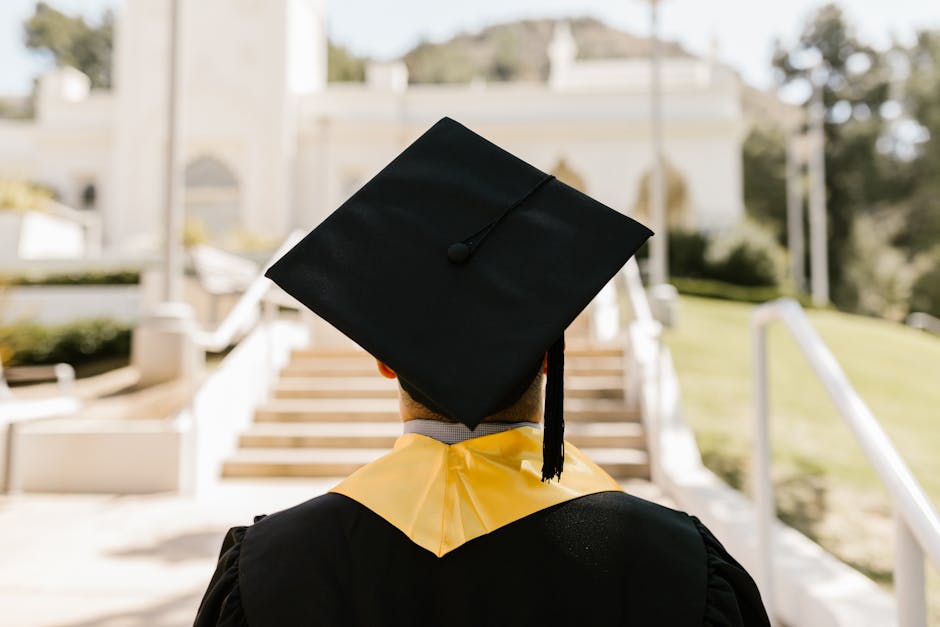 Graduate reviewing student loan repayment on laptop
