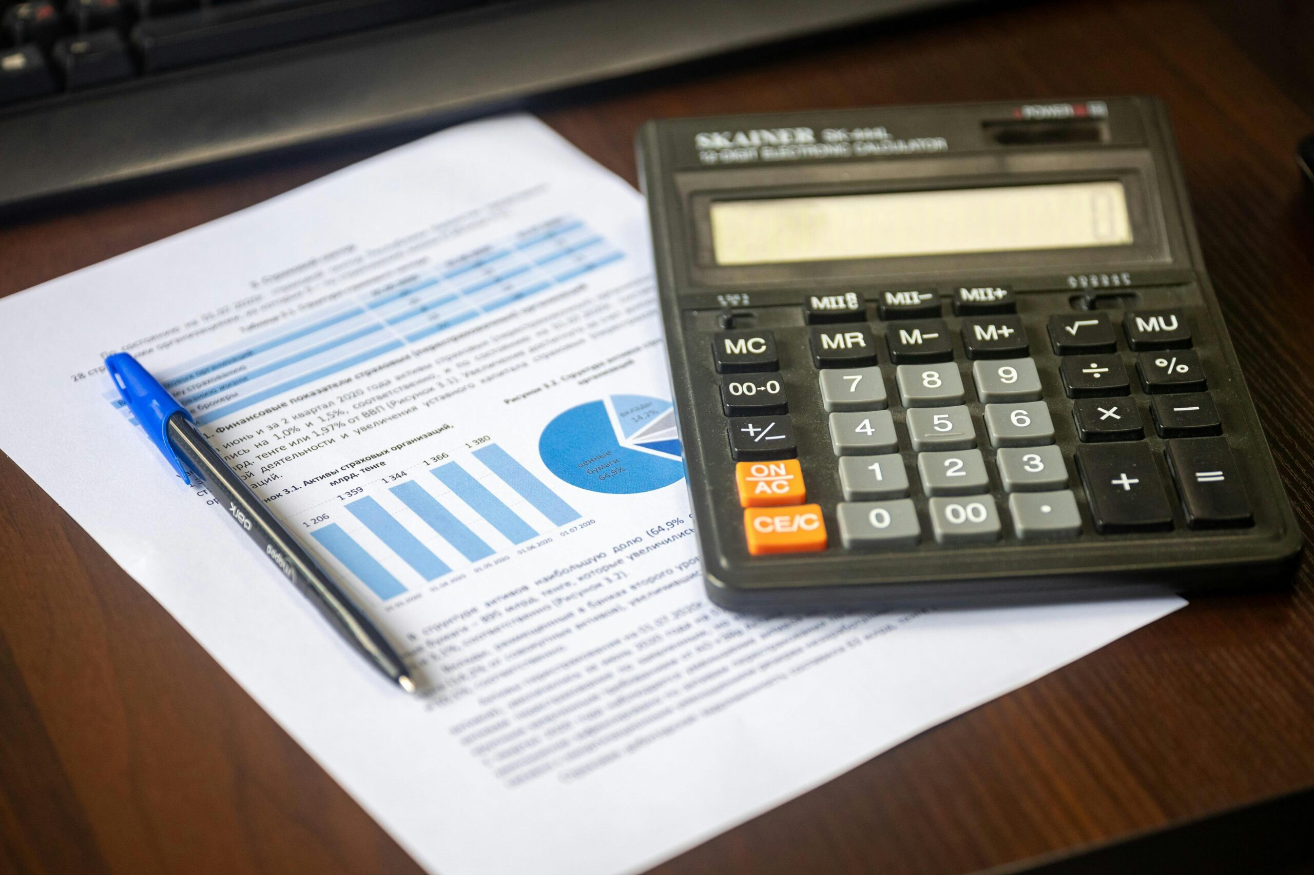 Calculator and pen on a financial planning worksheet