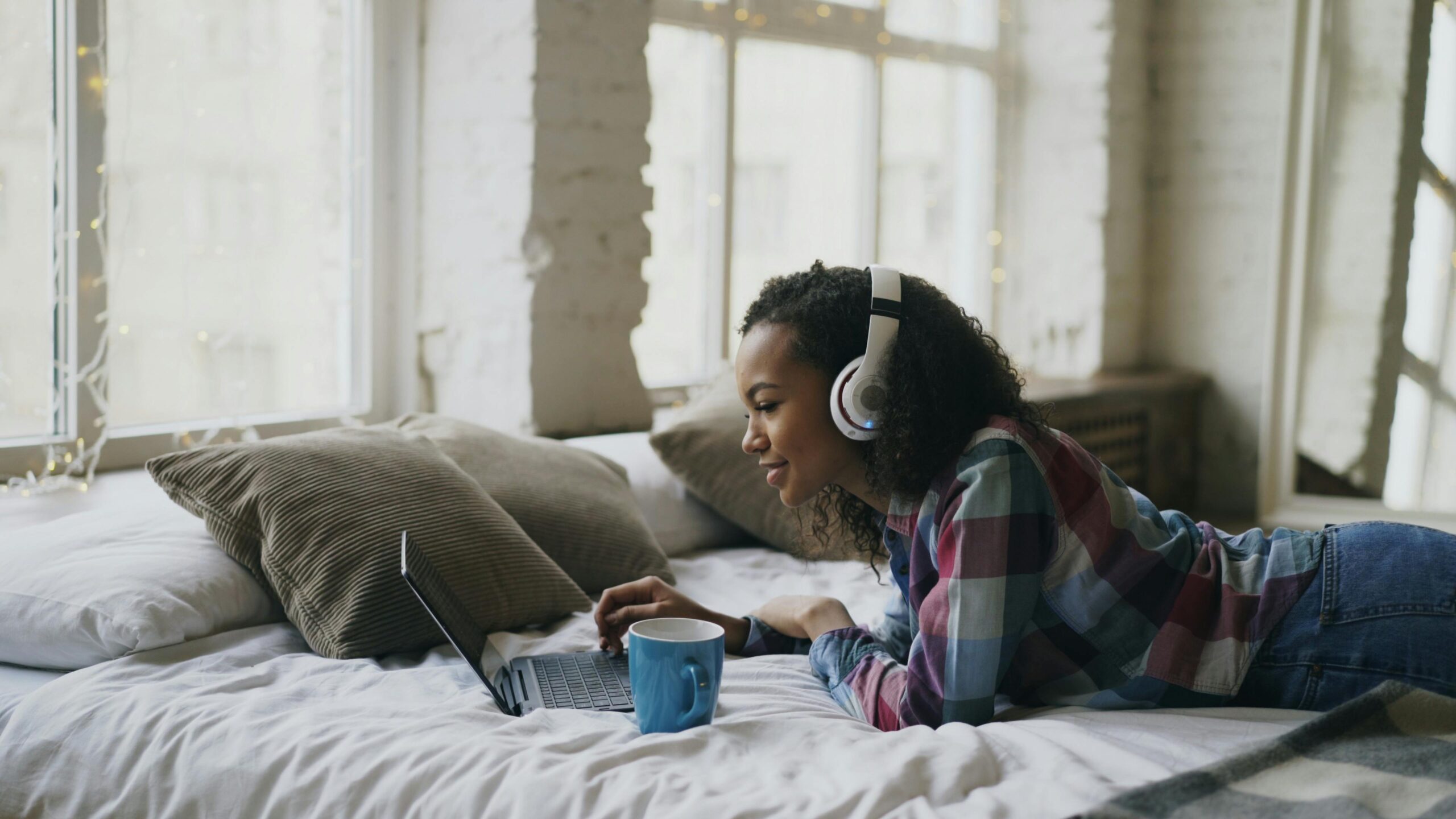 Young person streaming content in a student bedroom