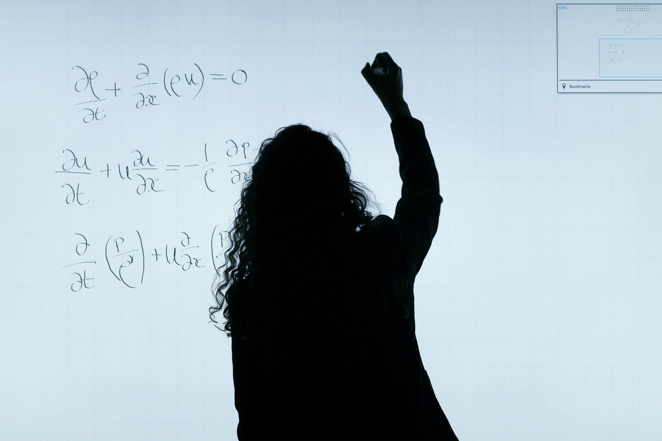 A student practising mathematical reasoning questions on a laptop at home