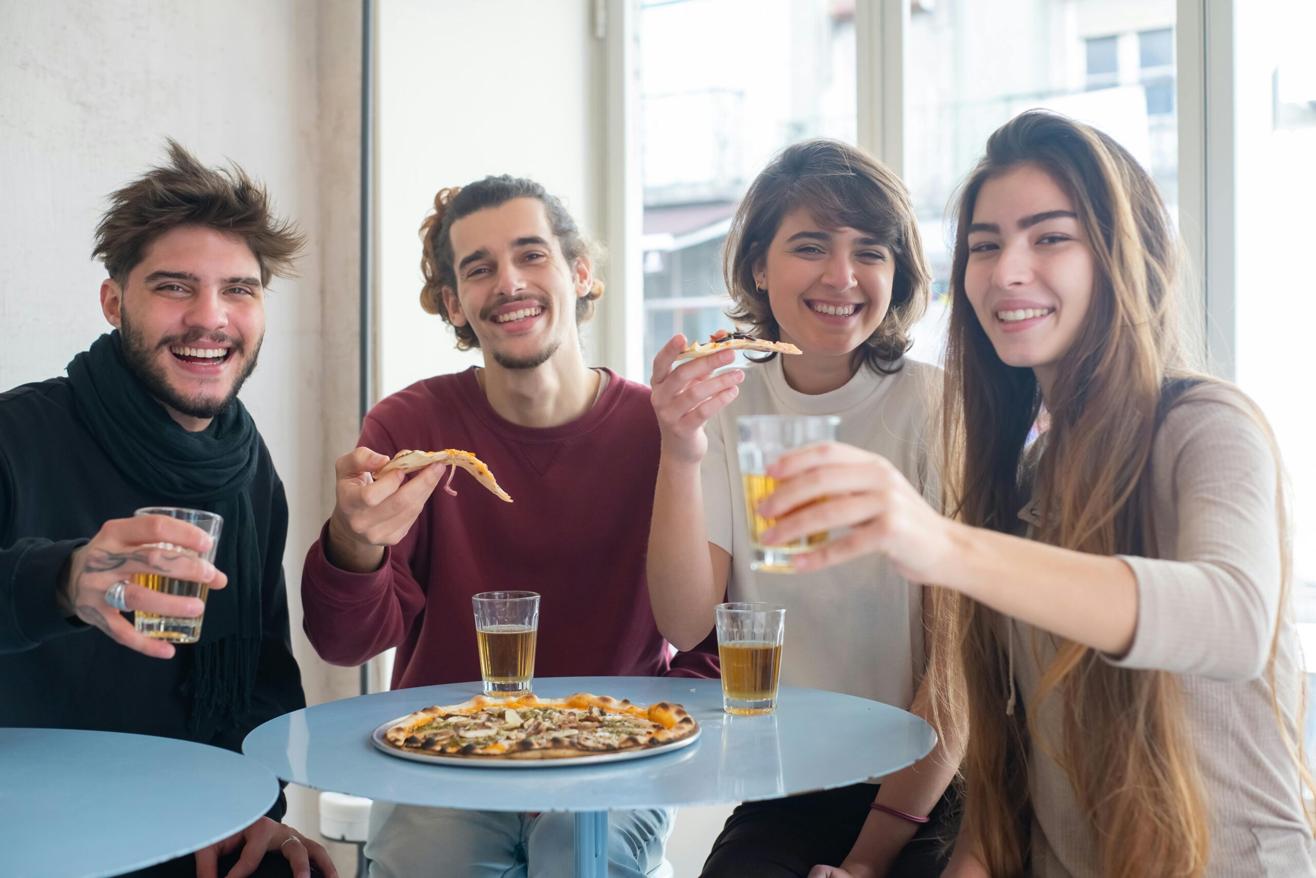 Friends sharing food at a casual cafe with student deals