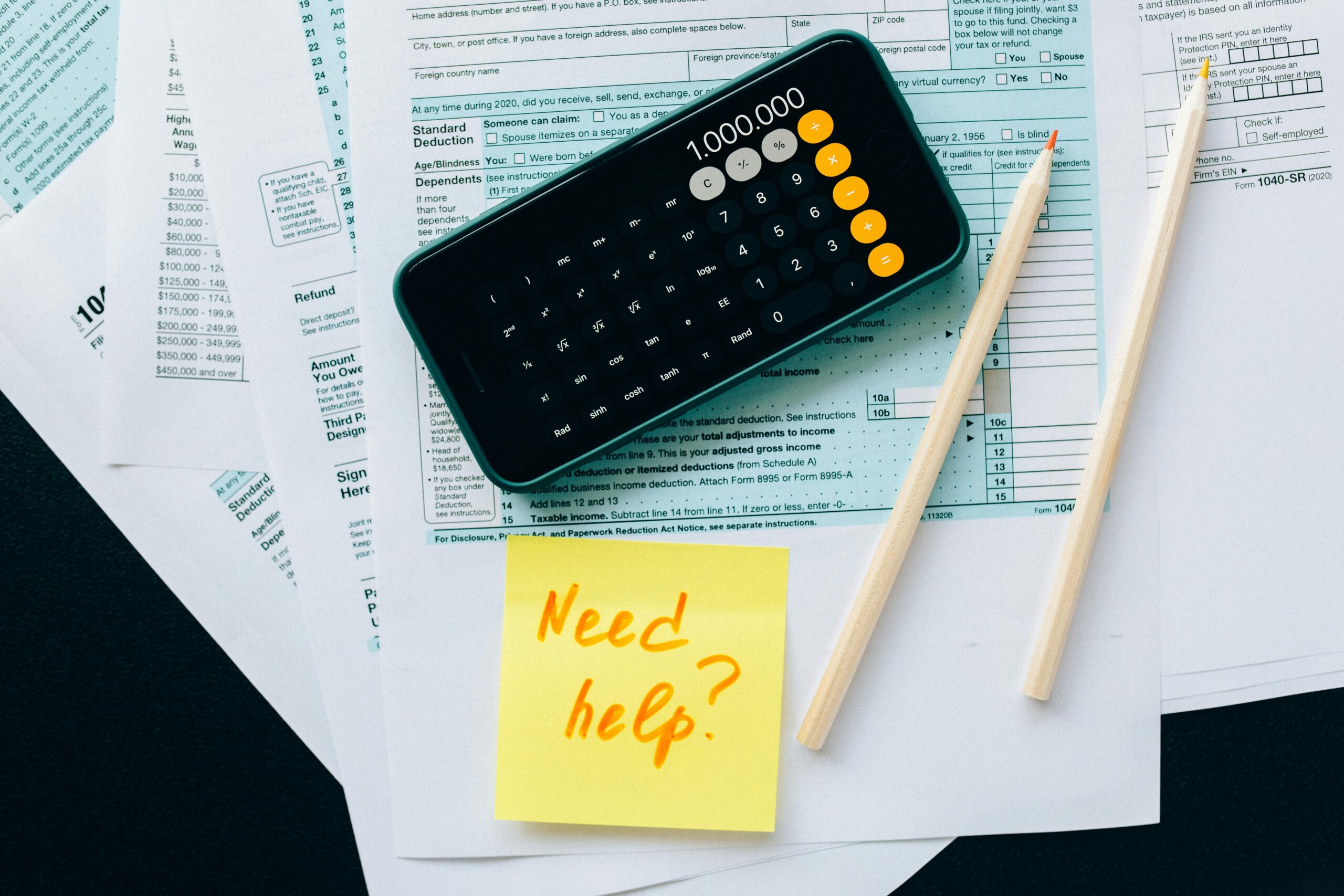 Tax and salary documents laid out for financial planning