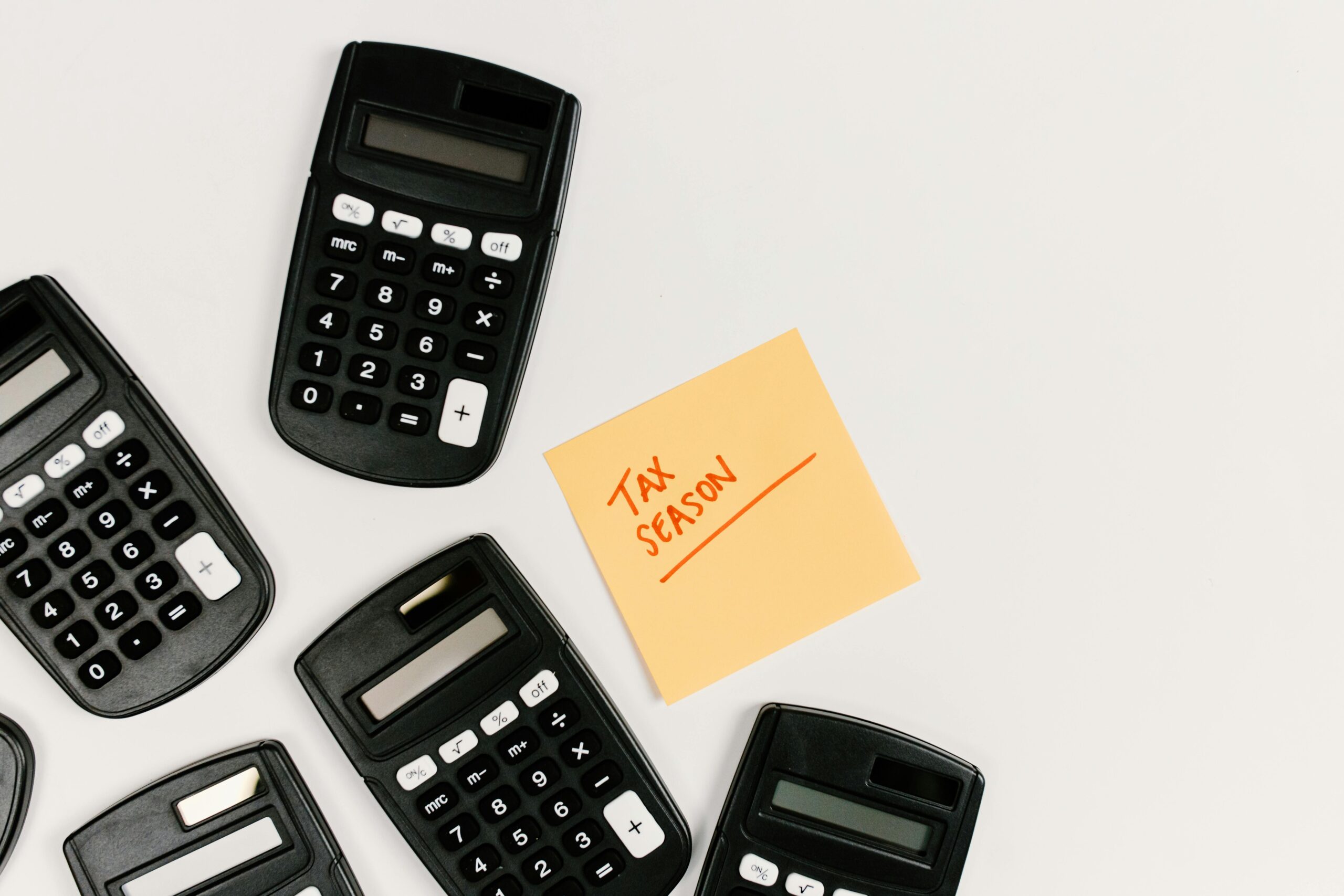 Calculator and tax documents for working out take-home pay