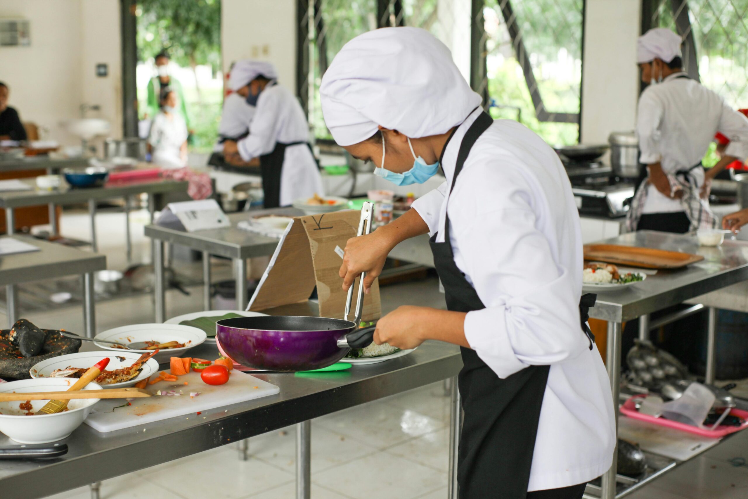 Student batch cooking a healthy meal in a shared kitchen