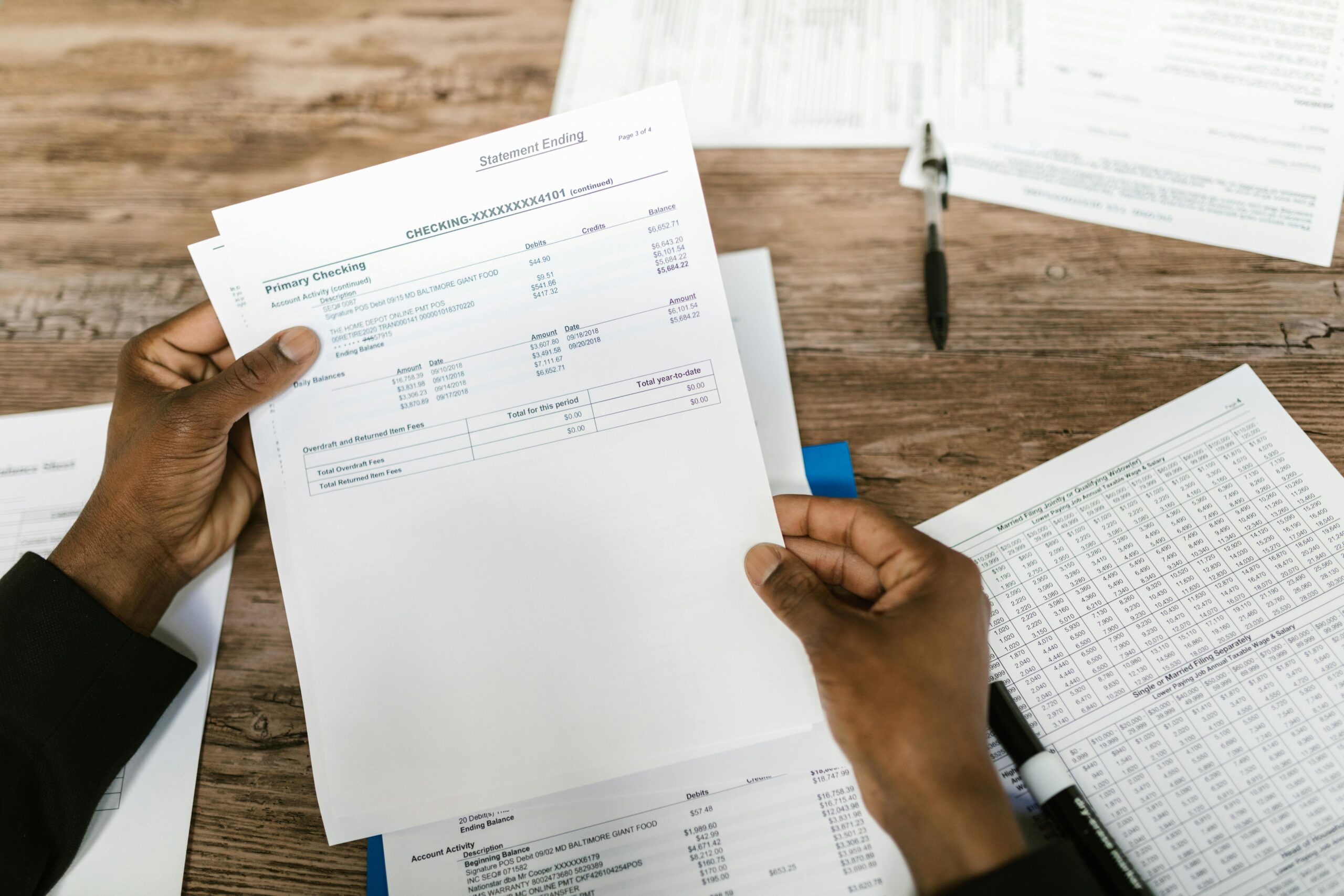 Financial planning paperwork including NI and tax forms