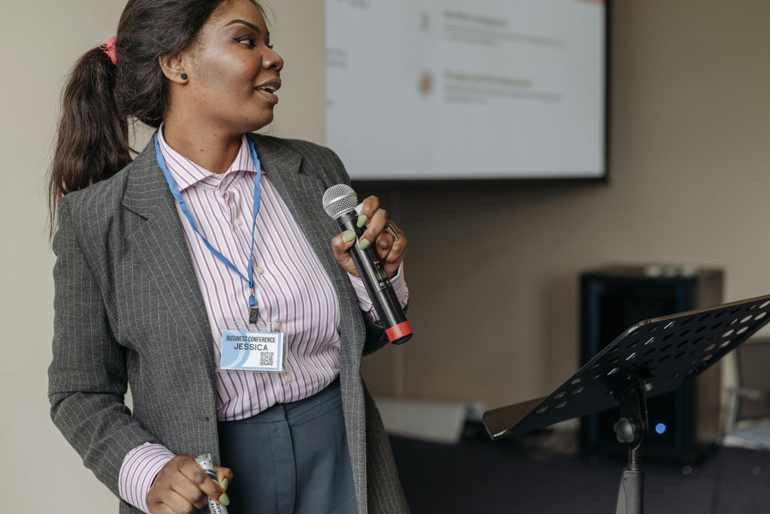 Young person confidently giving a public presentation