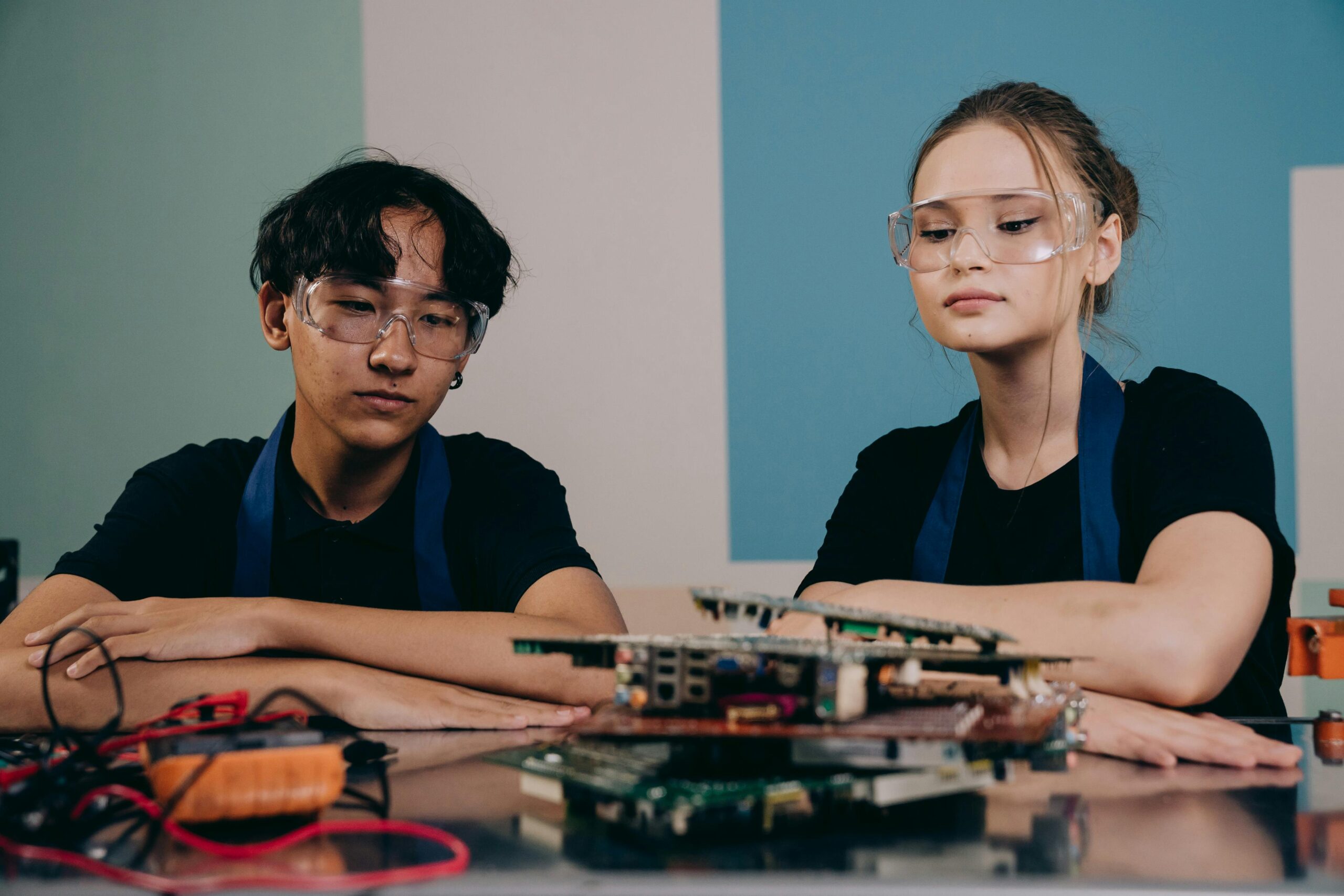 Young people collaborating on a project around a table