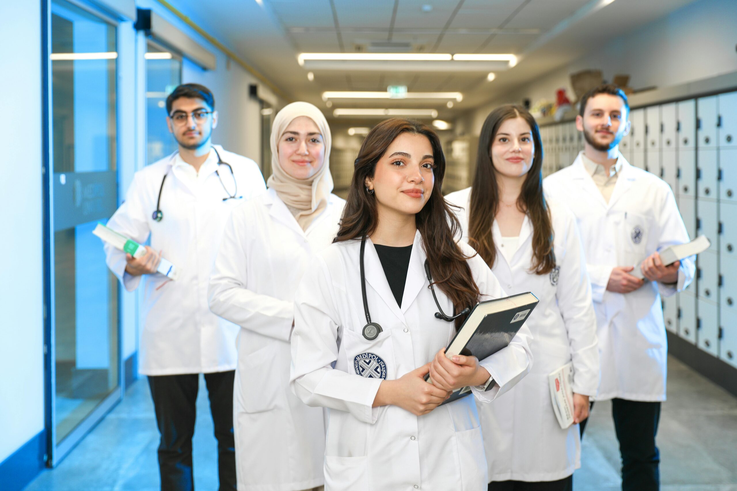 A student writing notes during a medical work experience placement