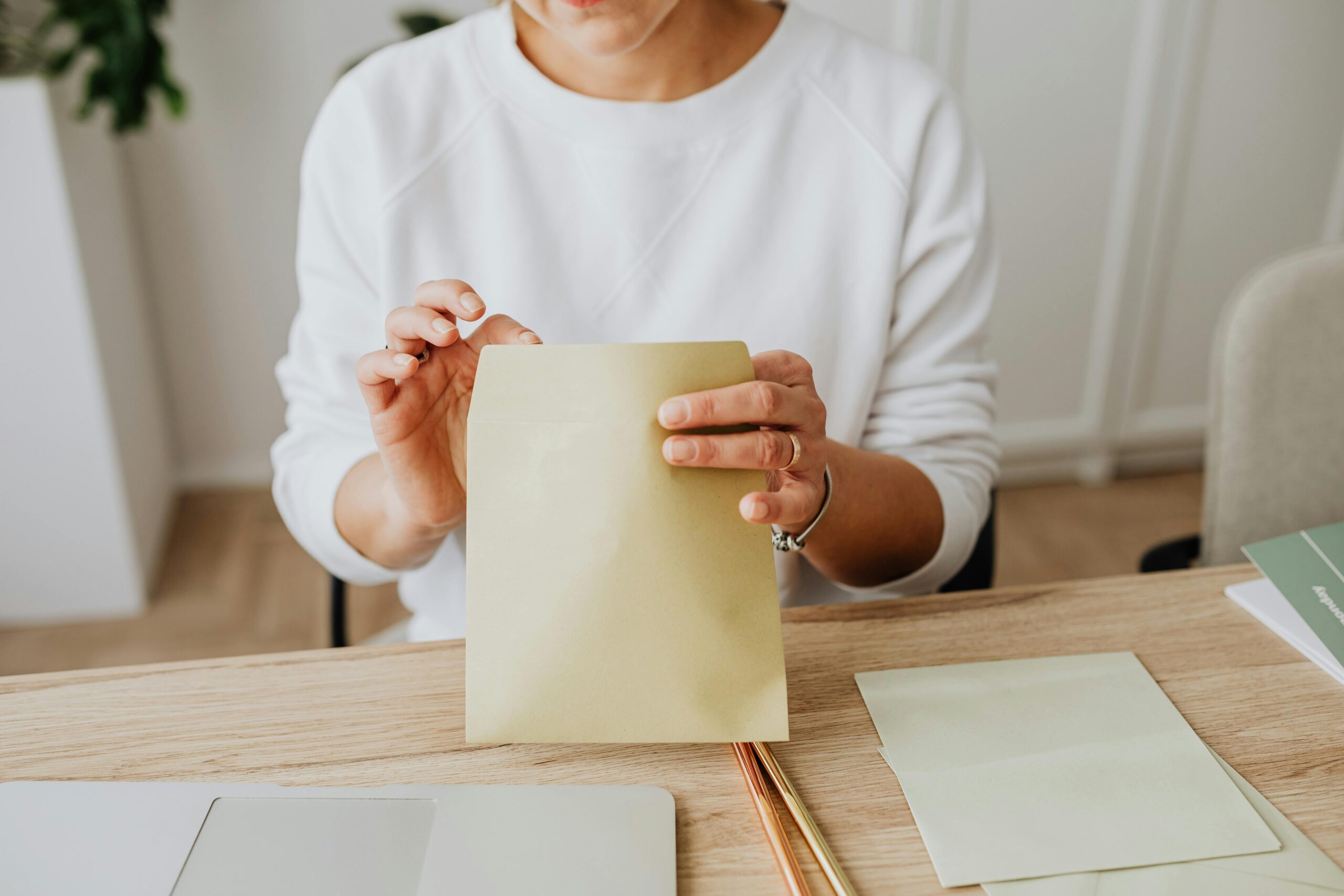 Stack of official-looking letters and envelopes on a desk