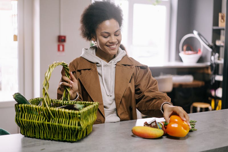 Woman selecting fresh vegetables while grocery shopping