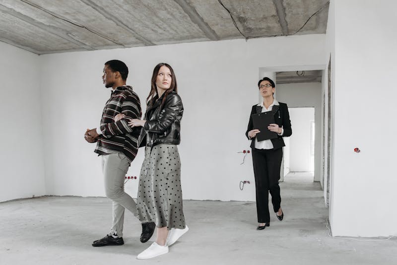 Estate agent showing potential tenants around a property