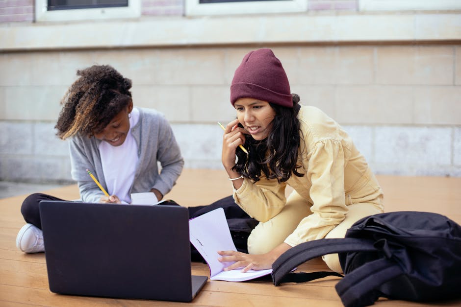 Best laptops for students: laptop on a study desk with notebook