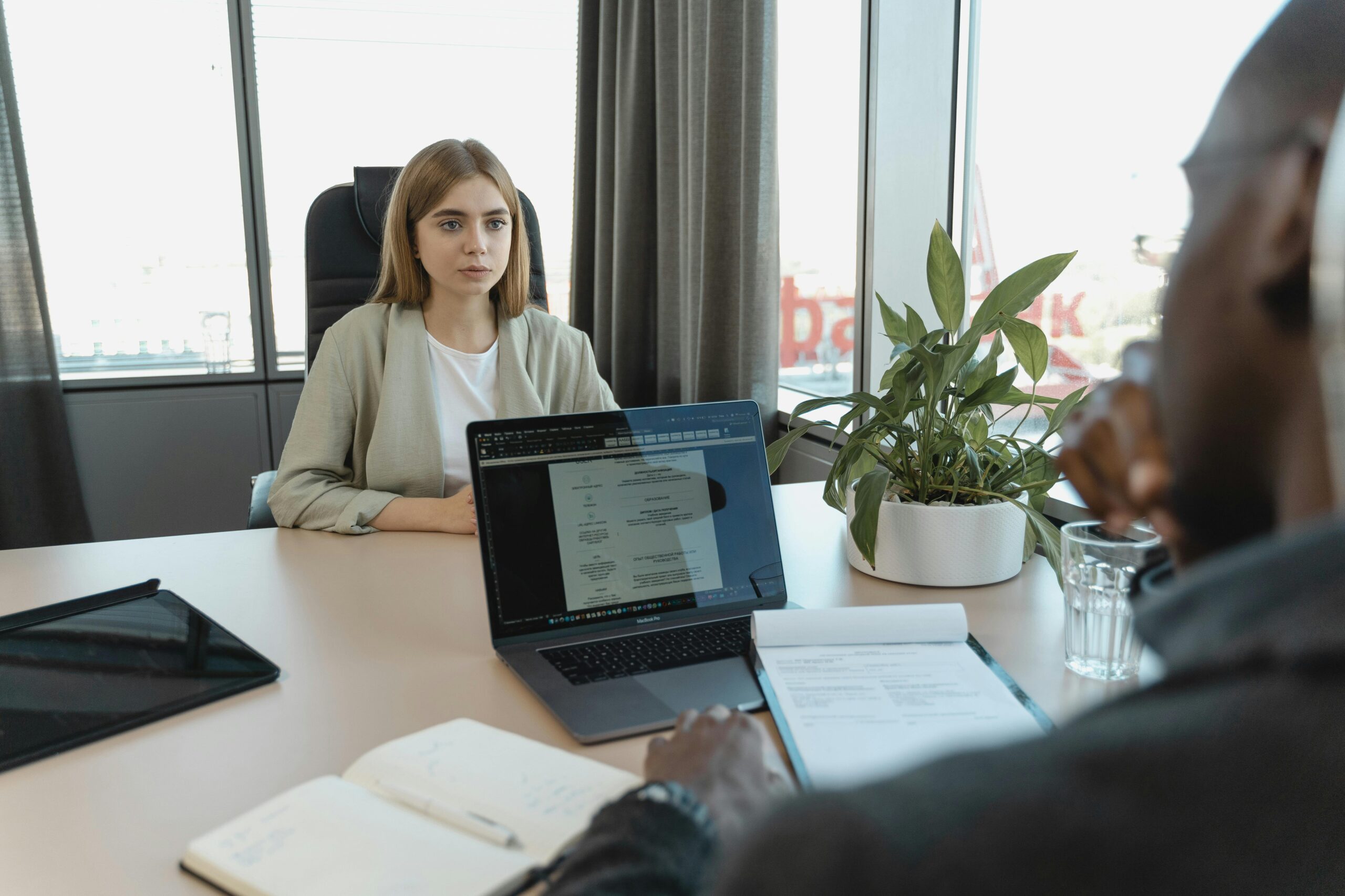 Interview preparation notes next to a laptop ready for a video call