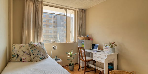 Student room with furniture and laptop
