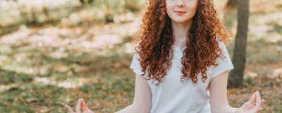 Person doing yoga outdoors