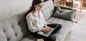 Student using laptop at home
