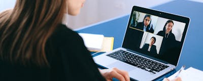 Student working at desk with assistive technology