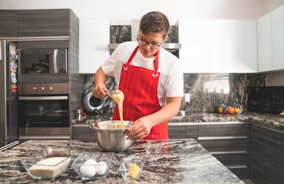 Young person cooking in a modern kitchen