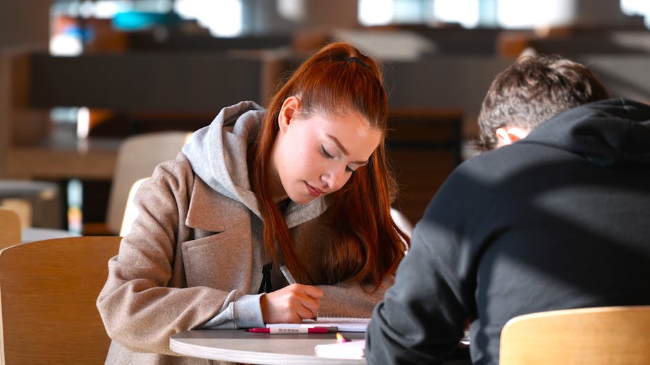 Student calculating savings on a laptop