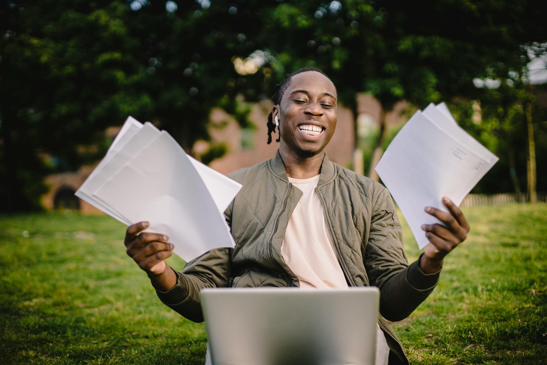 Student with papers and laptop preparing a Student Finance England application