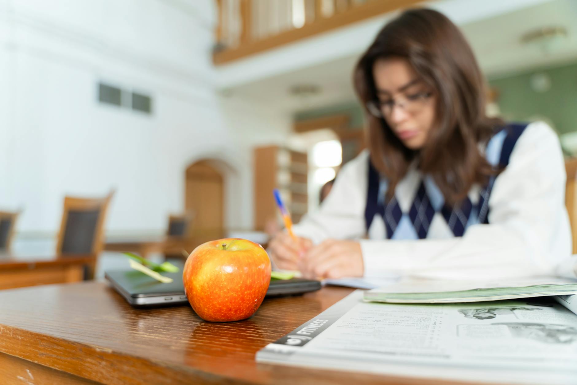 Student working through loan paperwork and repayment notes on a desk