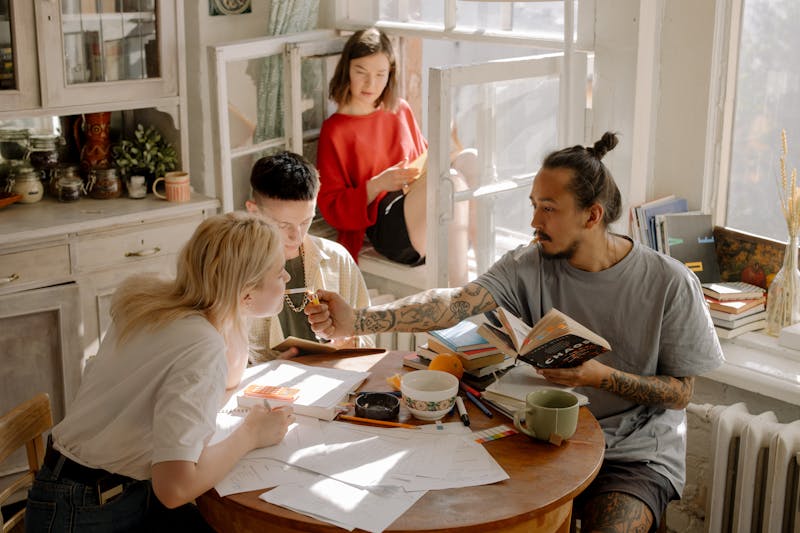 Group of young adults relaxing together in a shared student flat
