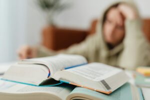 Student revising for exams with flashcards at a desk