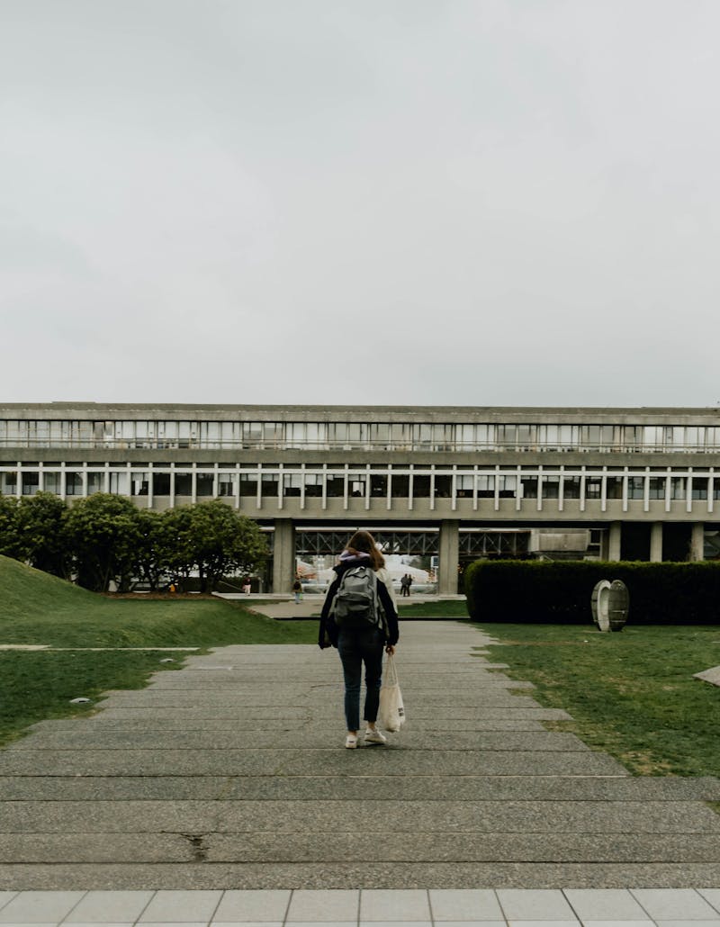 Student with backpack travelling abroad on campus