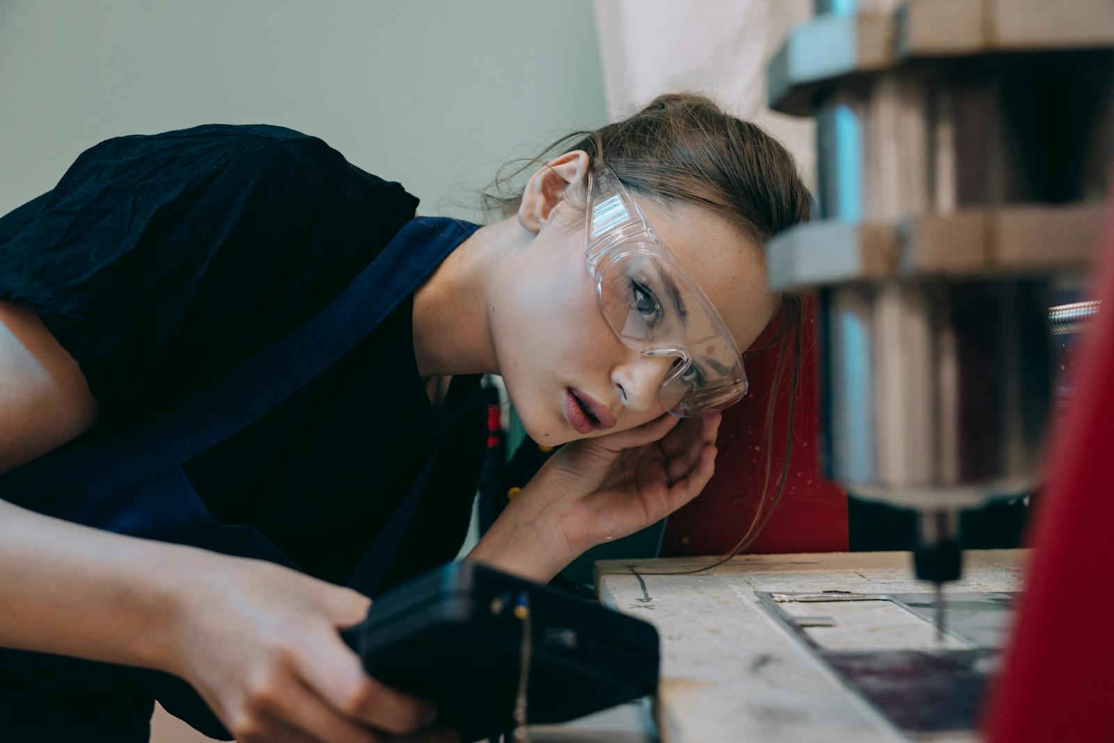 Student writing a CV at a kitchen table preparing summer applications