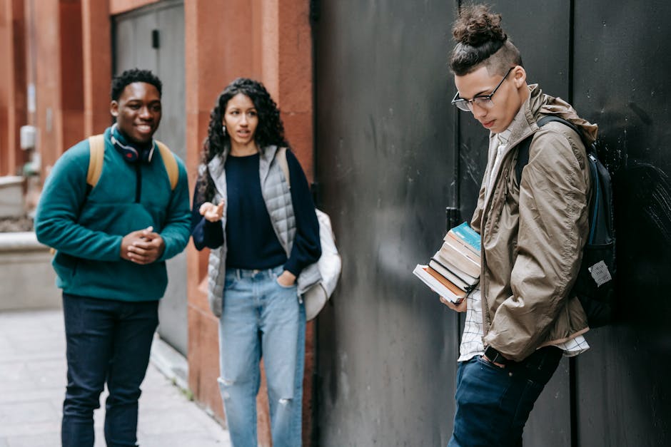 Three students comparing discount apps on their phones