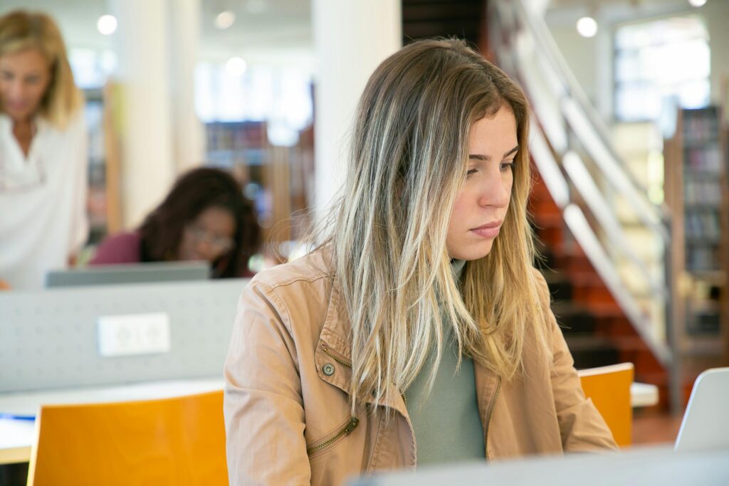 Worried weekend student checking maintenance loan account on a laptop