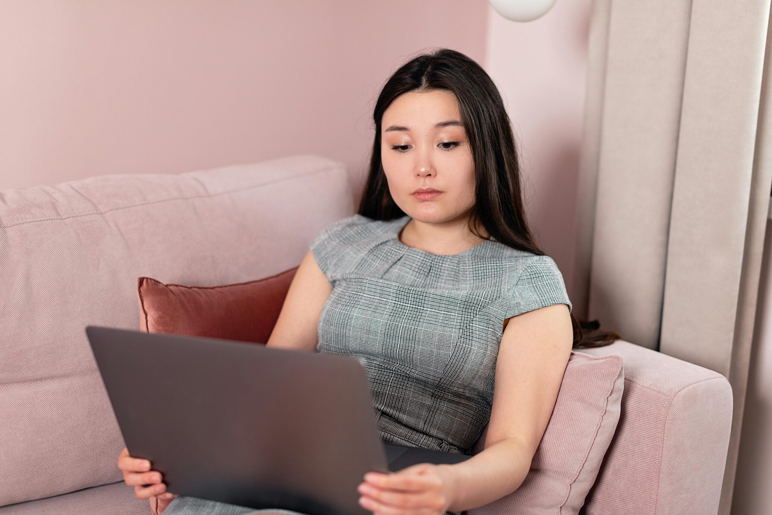 Student reviewing financial documents on a laptop