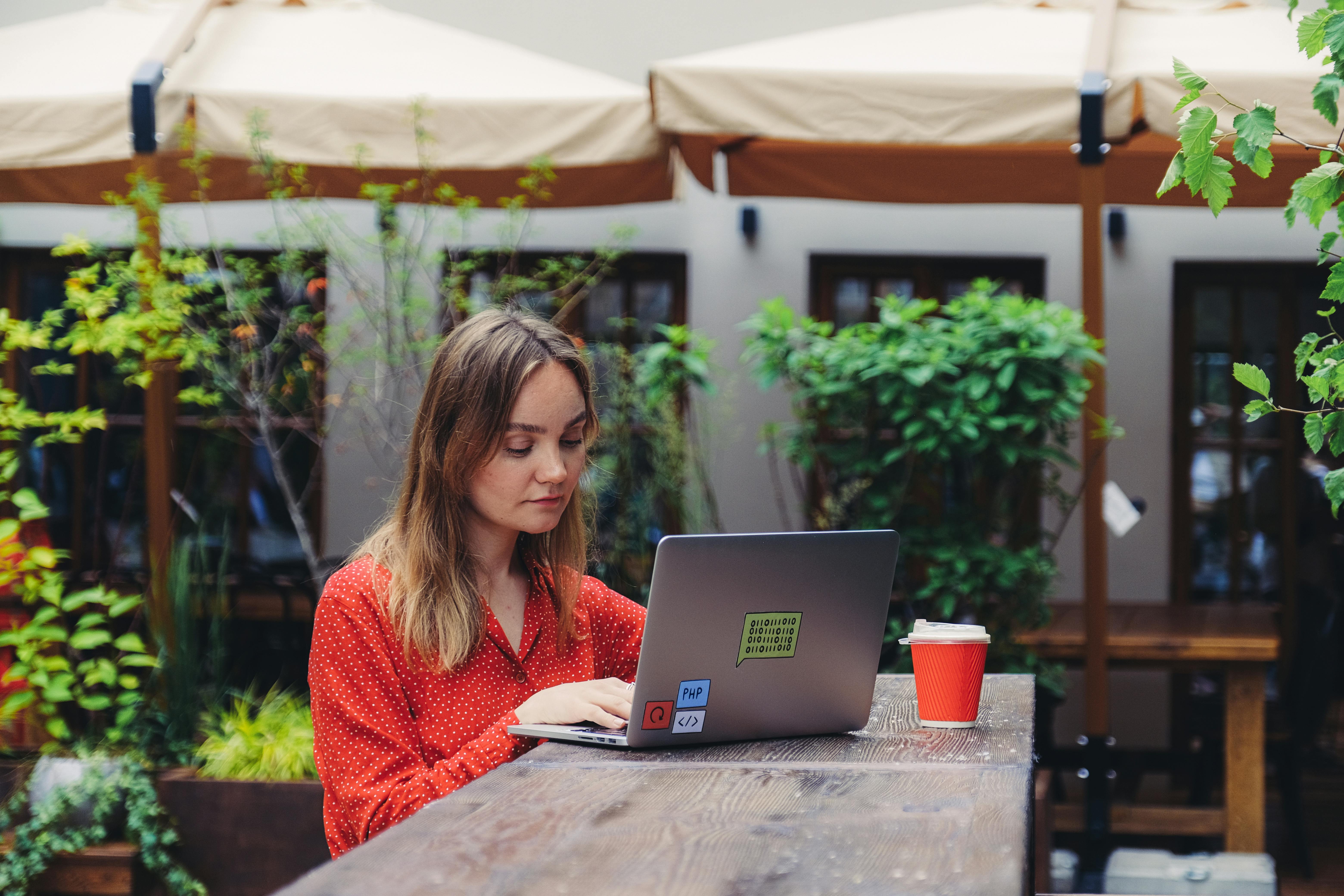 UK student editing a budget template on a laptop at home