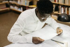 Student studying at desk for exams