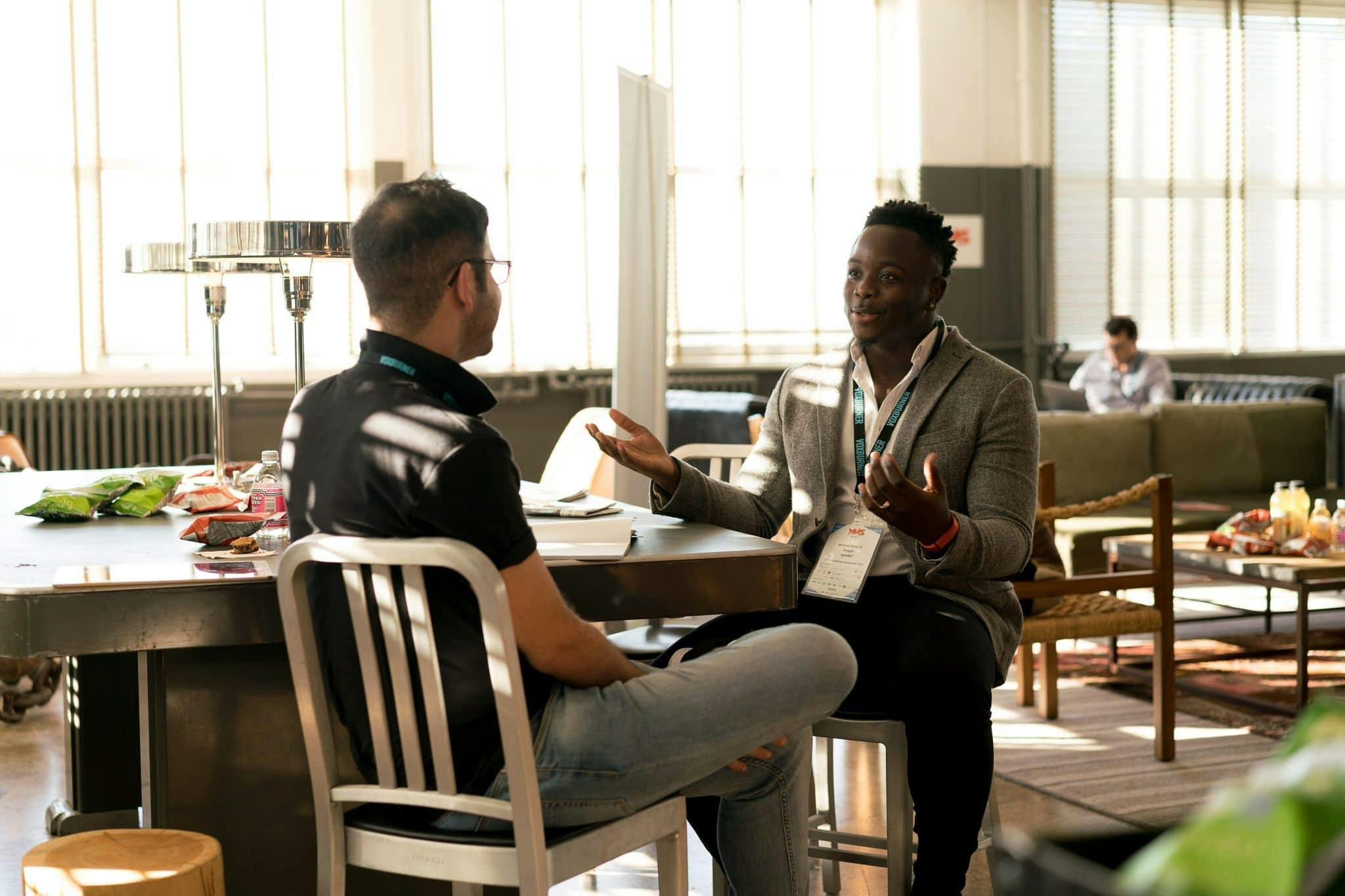 Intern learning from a mentor during a UK workplace placement