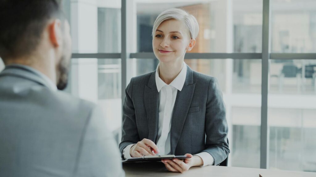 Young professional reviewing job application on laptop
