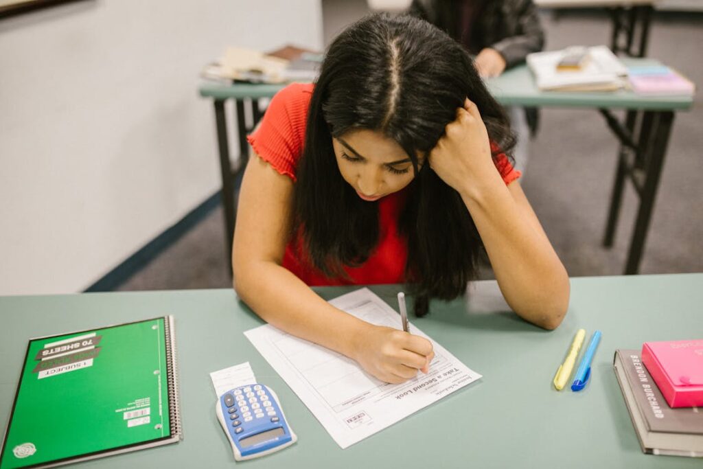 Student studying at a desk during exam season