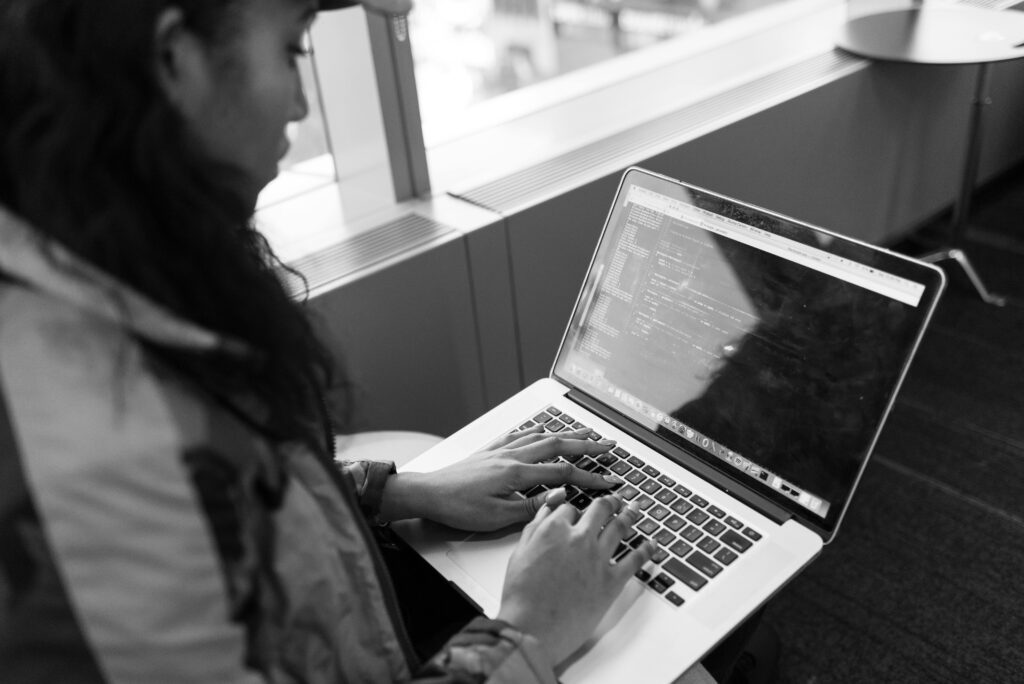 UK graduate using AI tools at a professional desk
