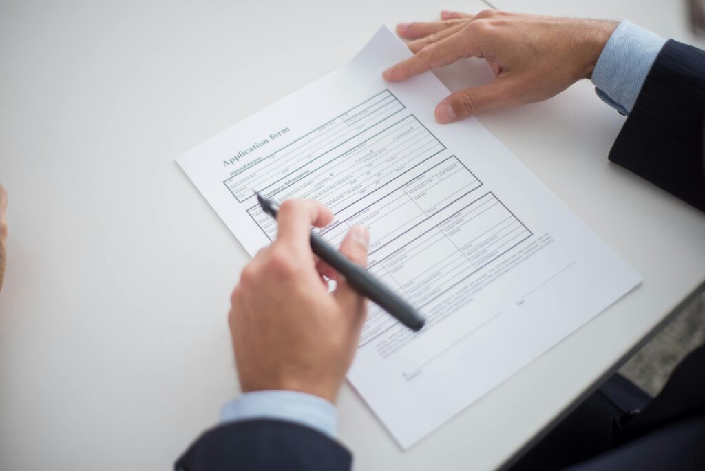 Young UK professional preparing application for a graduate role