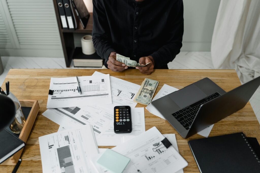 UK young person reviewing budget at a desk