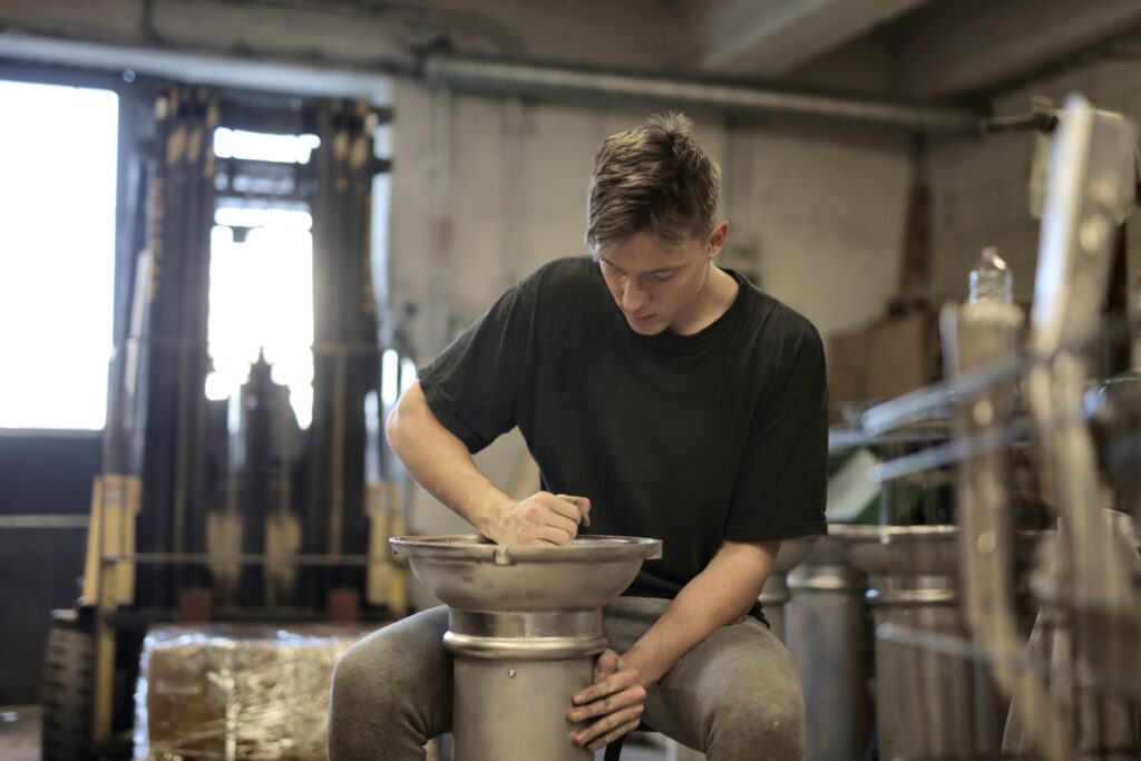 A young apprentice working in a hands-on workshop setting