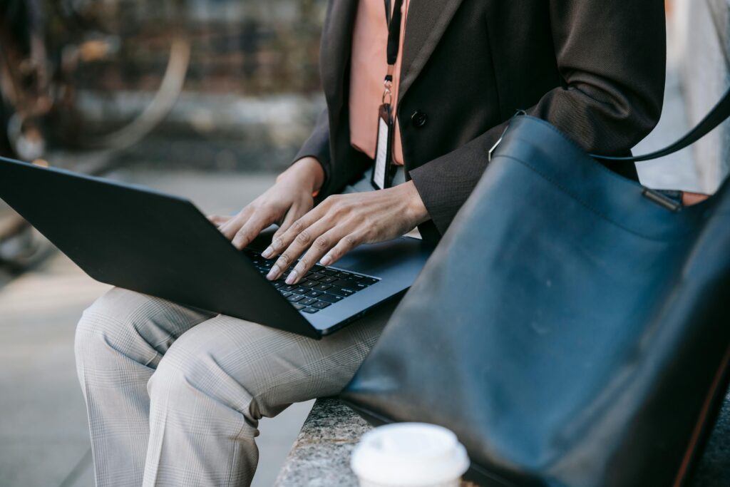 A graduate searching for jobs on a laptop
