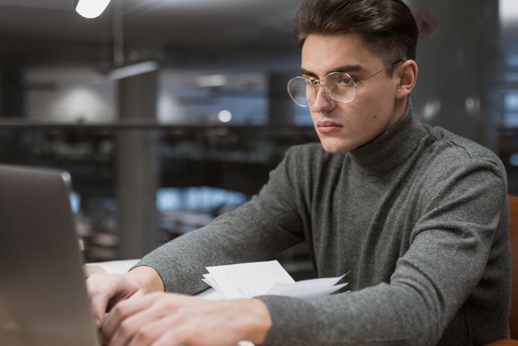 A student checking their university email on a laptop