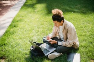A student drafting a personal statement on a laptop