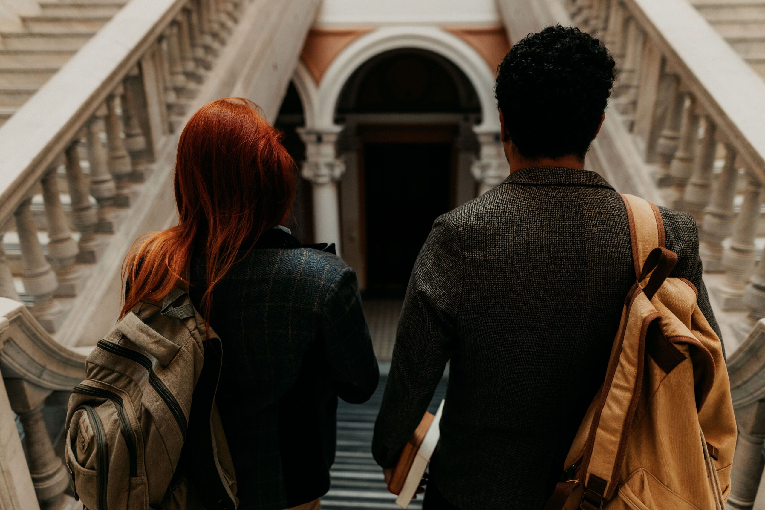Students walking on a UK university campus, where Clearing places tens of thousands each year