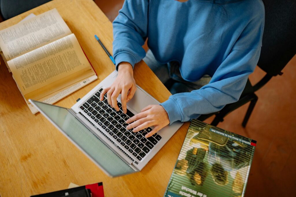 A student checking their UCAS Hub on results day after missing their firm offer by one grade