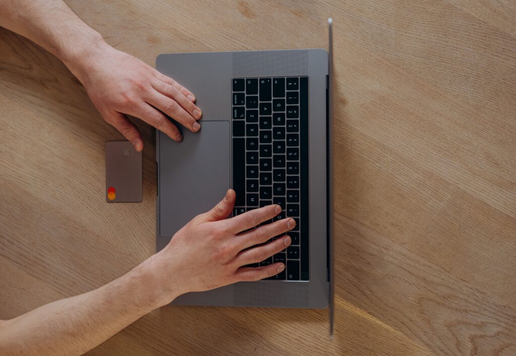 Paying a booking deposit online by credit card on a laptop