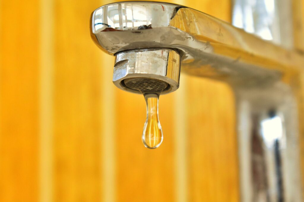 Close-up of a dripping chrome tap
